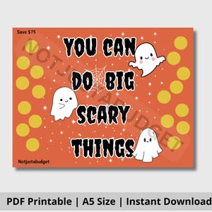 Könnte beinhalten: Ein orangefarbener Druck mit dem Text "YOU CAN DO BIG SCARY THINGS" und Geisterillustrationen. Das Design umfasst gelbe Kreise und ein Spinnennetz. Der Text "Save $75" befindet sich oben links.