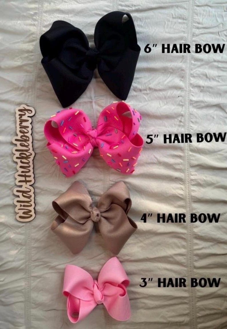 May include: Four hair bows arranged vertically. The top is black, labeled 6" HAIR BOW. The second is pink with multi-colored sprinkles, labeled 5" HAIR BOW. The third is tan, labeled 4" HAIR BOW. The bottom is light pink, labeled 3" HAIR BOW.