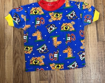 Top de bebé con estampado animal de colores primarios vintage