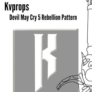 May include: A black and white line drawing of a sword with a skull-like face and a large, stylized letter "K" on a gray background. The text "Devil May Cry 5 Rebellion Pattern" is above the image. The Devil May Cry 5 logo is below the image.