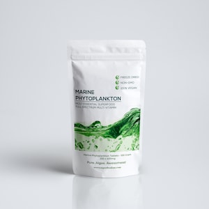 May include: White pouch with a green and blue design. The pouch contains Marine Phytoplankton tablets, a freeze-dried, non-GMO, and 100% vegan superfood. The text on the pouch reads "Marine Phytoplankton, Most Essential Superfood, Full Spectrum Multi Vitamin, Freeze Dried, Non-GMO, 100% Vegan, Marine Phytoplankton Tablets - 100 Caps, 250g = 4000mg, Pure. Algae. Awesomess!"