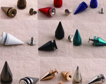 May include: Assortment of metal pyramid-shaped studs in various colors, including gold, silver, black, red, blue, and green. Each stud has a screw-on base for attaching to fabric or leather.