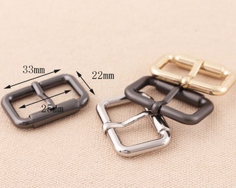 May include: Three metal belt buckles in different finishes: black, silver, and gold. The black buckle measures 33 mm by 25 mm and 22 mm wide.