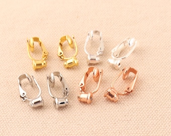 May include: Eight earring clips in gold, silver, and rose gold. The clips are designed to hold earrings in place.