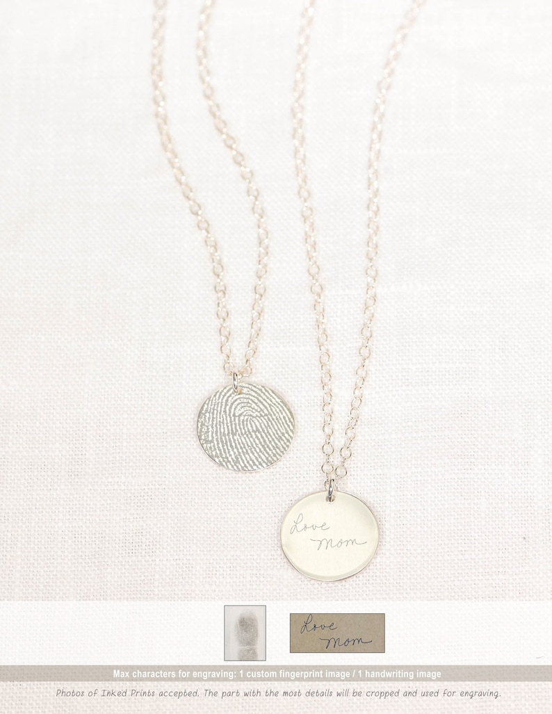 May include: Two silver necklaces with round pendants. One pendant features a fingerprint design, the other has the words "Love Mom" engraved on it.