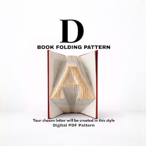 May include: An open book with red covers, folded to create a letter "A". The text "D" and "BOOK FOLDING PATTERN" are above the book. Below the book, the text reads "Your chosen letter will be created in this style Digital PDF Pattern".
