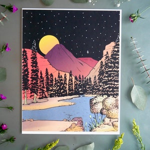 May include: A retro-style print of a nighttime landscape with a full moon, mountains, and a river winding through a forest. The colors are vibrant and the style is reminiscent of 1970s art.