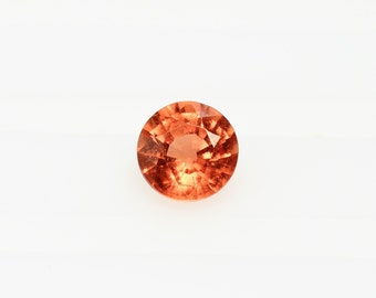 Fire orange sapphire from the volcano round 4.5 mm, this stone with a warm color weighs 0.48 carat and comes from Africa