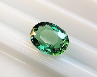 Teal green tourmaline oval cushion 7.5x9.6 mm, this bluish green stone weighs 2.15 carats and comes from Africa