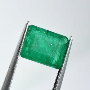 Colombian emerald, emerald cut, calibrated 9x7, this slightly bluish-green gemstone weighs 2.14 carats
