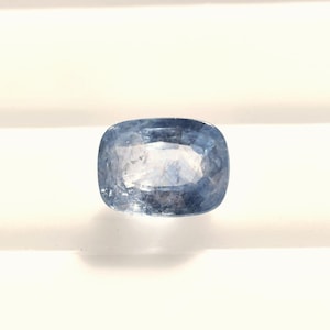 A dusty, frosted, cushion-cut 8x6 blue sapphire, this included corundum from Sri Lanka weighs 1.72 carats.