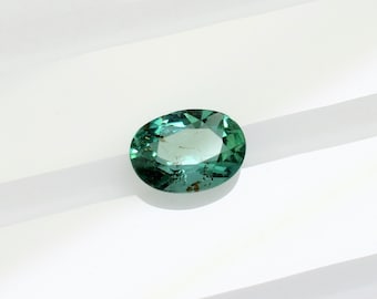 Natural untreated bluish green and transparent emerald, this small oval Zambian beryl 6.3x4.7 mm weighs 0.58 carat