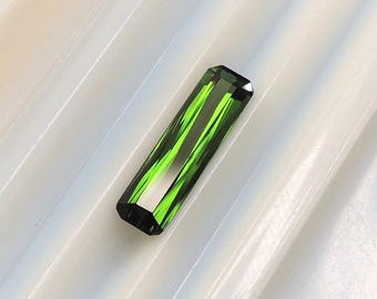 Radiant elongated forest green tourmaline, this elongated conifer green gem weighs 2.80 carats, measures 5.3x14.2 mm and comes from Africa