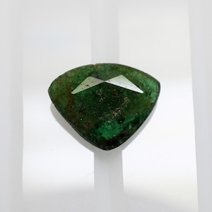 Large flat trillion emerald 9.8x7.7 mm, this forest green beryl weighs 1.44 carats and comes from Zambia
