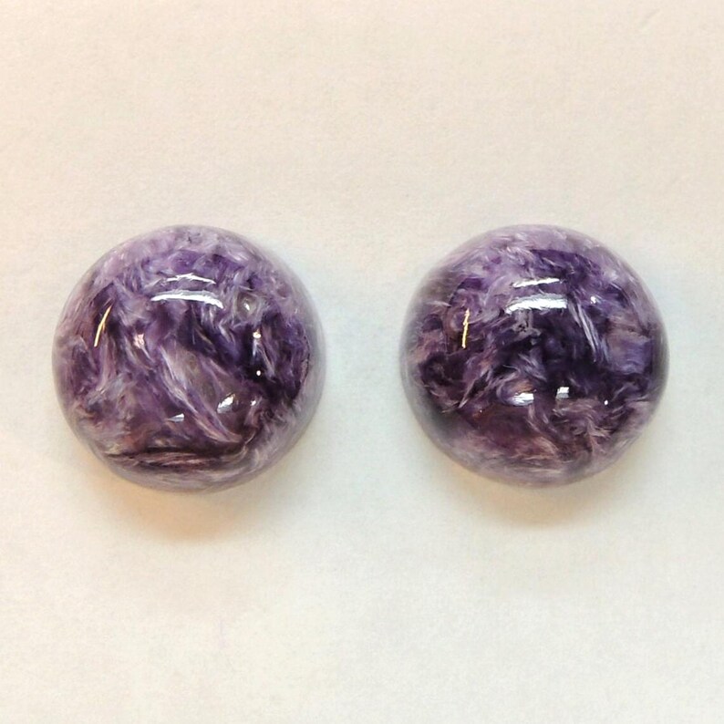 Charoite pair, round 11mm cabochons, these marbled purple cabochons come from Siberia in Russia and weigh 10.67 carats. image 2
