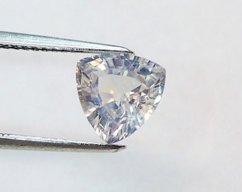 Trillion colorless sapphire 7.4 to 7.6 mm, this slightly milky stone weighs 1.78 carat and comes from Sri Lanka