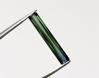 Green two-tone indicolite tourmaline with blue tip, this elongated radiant stone 20.7x3.5mm weighs 2.25 carats and comes from Nigeria