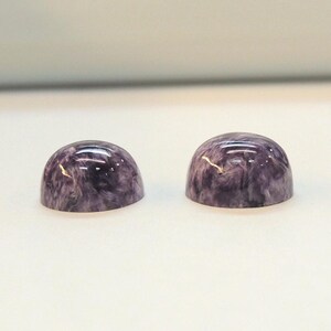 Charoite pair, round 11mm cabochons, these marbled purple cabochons come from Siberia in Russia and weigh 10.67 carats. image 8