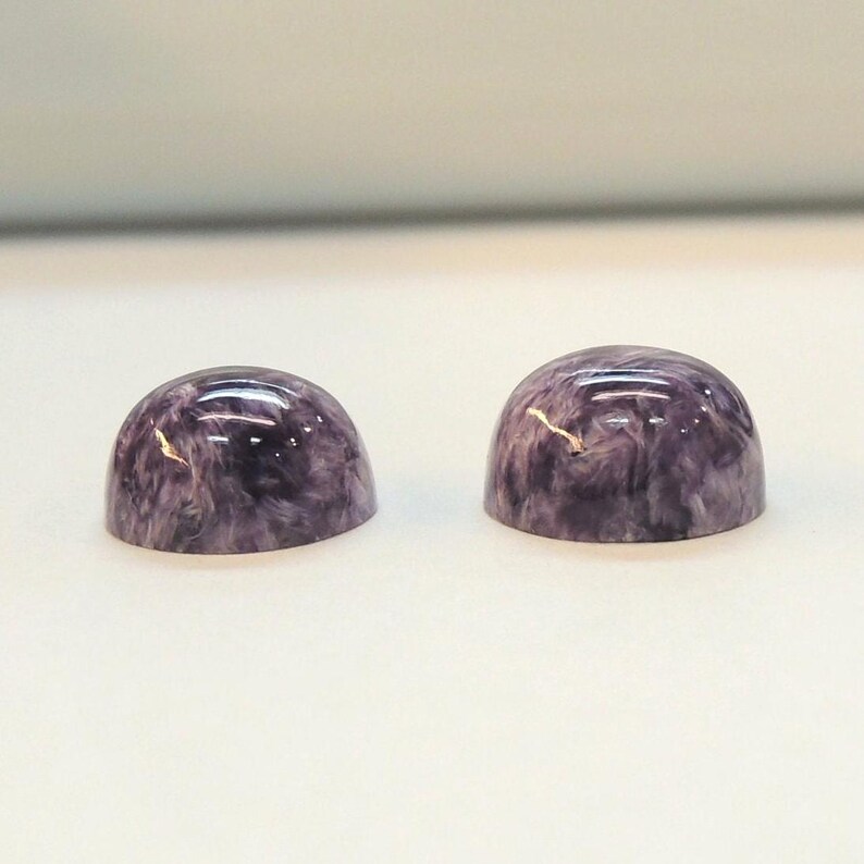 Charoite pair, round 11mm cabochons, these marbled purple cabochons come from Siberia in Russia and weigh 10.67 carats. image 8