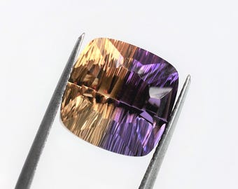 Cushion ametrine 14 mm with concave cuts, this large bicolor quartz weighs 13.30 carats and comes from Bolivia