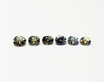 Saphir vert et bicolore bleu-jaune = vert, cette suite de petits corindons ovales 5x4 pèse 2.91 carats et provient du Sri-Lanka