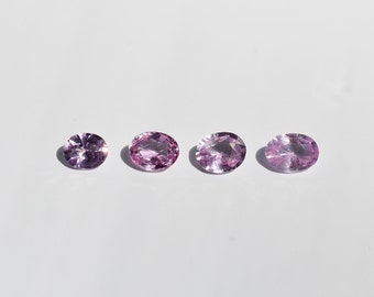 Small pink to purple sapphires, various shades of pink, oval 3.1x3.6 to 3.3x4.6, these four VS purity corundums come from Africa