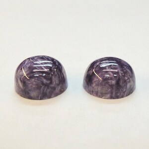 Charoite pair, round 11mm cabochons, these marbled purple cabochons come from Siberia in Russia and weigh 10.67 carats. image 6