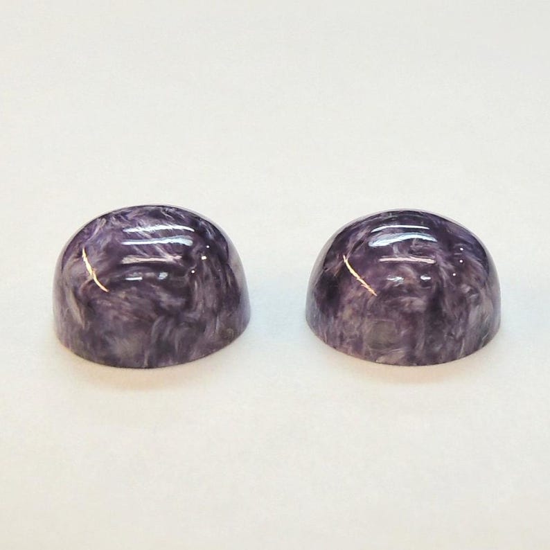 Charoite pair, round 11mm cabochons, these marbled purple cabochons come from Siberia in Russia and weigh 10.67 carats. image 6