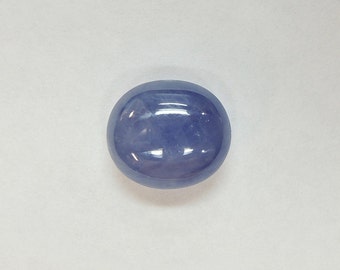 Velvety blue cabochon sapphire, this large oval stone measures 9.6x10.9 mm, weighs 6.24 carats and comes from Burma