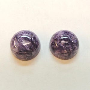 Charoite pair, round 11mm cabochons, these marbled purple cabochons come from Siberia in Russia and weigh 10.67 carats. image 3