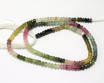 A strand of multicolored tourmalines, 3.4 to 3.6 mm, this string of small, faceted, rainbow-colored beads measures 14 inches