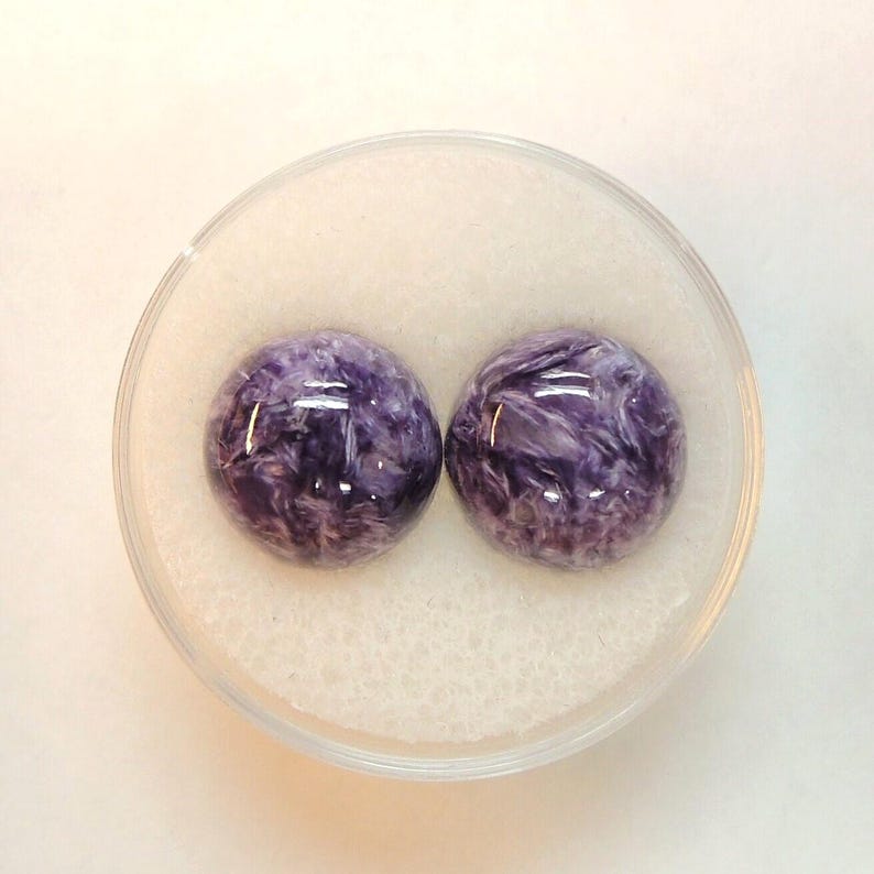 Charoite pair, round 11mm cabochons, these marbled purple cabochons come from Siberia in Russia and weigh 10.67 carats. image 10