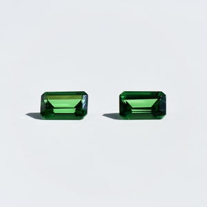 Tsavorite Chrome green garnet, this pair of 5x3 mm emerald cut stones weighs 0.73 carat and comes from Kenya