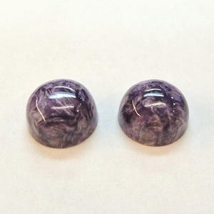 Charoite pair, round 11mm cabochons, these marbled purple cabochons come from Siberia in Russia and weigh 10.67 carats. image 4