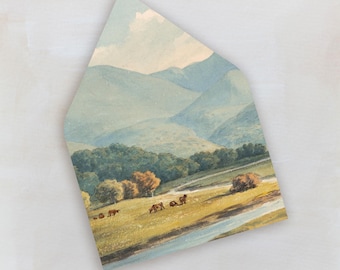 May include: An envelope featuring a pastoral landscape painting. The artwork depicts rolling green hills, a winding road, and grazing animals under a soft blue sky. The color palette includes greens, yellows, and blues.