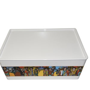 May include: A white rectangular storage container with a matching lid. The container's base features a colorful, detailed illustration of people in traditional attire. The artwork wraps around the container.