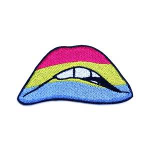 May include: Embroidered iron-on patch of a pair of lips in the colors of the pansexual pride flag: pink, yellow, and blue.