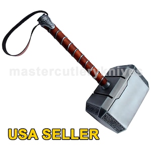 May include: A silver-colored hammer with a brown leather handle and a leather strap. The hammer has a detailed design on the head and handle. The hammer is a replica of Thor's hammer, Mjolnir, from the Marvel comics and movies. USA SELLER.