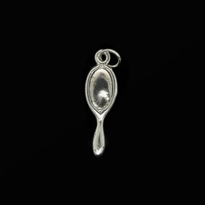 May include: A silver-colored charm in the shape of a hand mirror. The charm has an oval mirror surface and a handle. The charm is suspended from a small loop at the top. The background is black.
