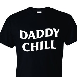 May include: Black t-shirt with white text that reads "Daddy Chill".