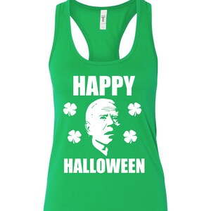 May include: Green tank top with a white silhouette of a person's face and the text "HAPPY HALLOWEEN" with four shamrocks.