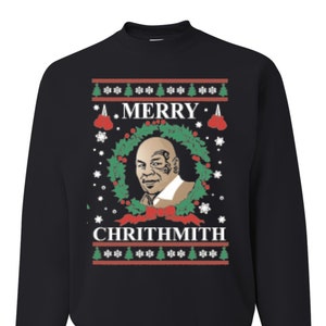 May include: Black Christmas sweater with a green wreath, red bow, and a white snowflake pattern. The sweater features a portrait of a man with a black eye and the text "A Merry Chrithmith".
