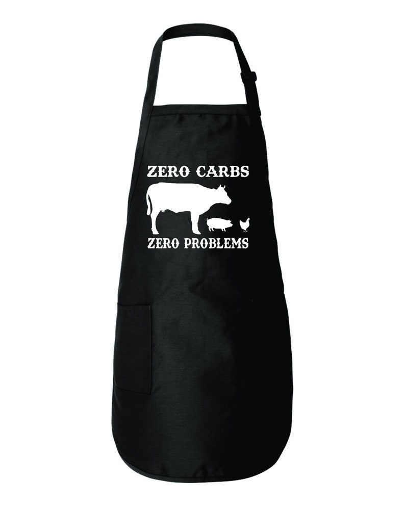 May include: Black kitchen apron with a white silhouette of a cow, pig, and chicken with the text "Zero Carbs Zero Problems".
