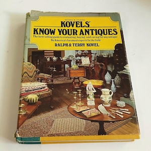 May include: A vintage copy of "Kovels' Know Your Antiques" book. The cover features a yellow banner with the title and author's names. The book's cover shows a room filled with antique furniture and decorative items.