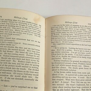 May include: An open book with text on aged, yellowed pages. The text is titled "Hilltops Clear" and is printed in black ink. The book is slightly open, revealing two pages of text.