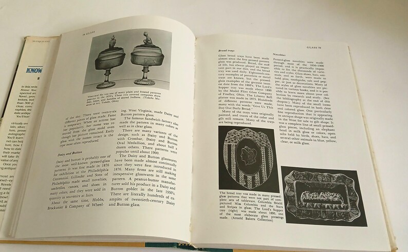 May include: An open book with illustrations of antique glassware and text. The left page features two drawings of glass pieces with lids. The right page has text and smaller images of decorative glass trays.