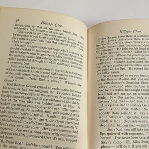 May include: Open book with text on aged pages. The pages are yellowed, and the text is in black. The book is open to two pages with text. The title "Hilltops Clear" is visible. The book appears to be an older edition.