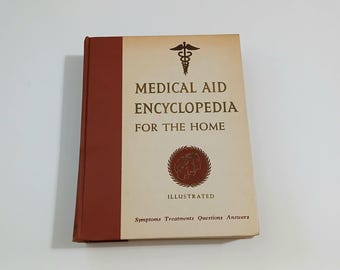 Enciclopedia de primeros auxilios médicos de los años 60 para el hogar. Libro de referencia de medicina retro vintage. Tapa dura.