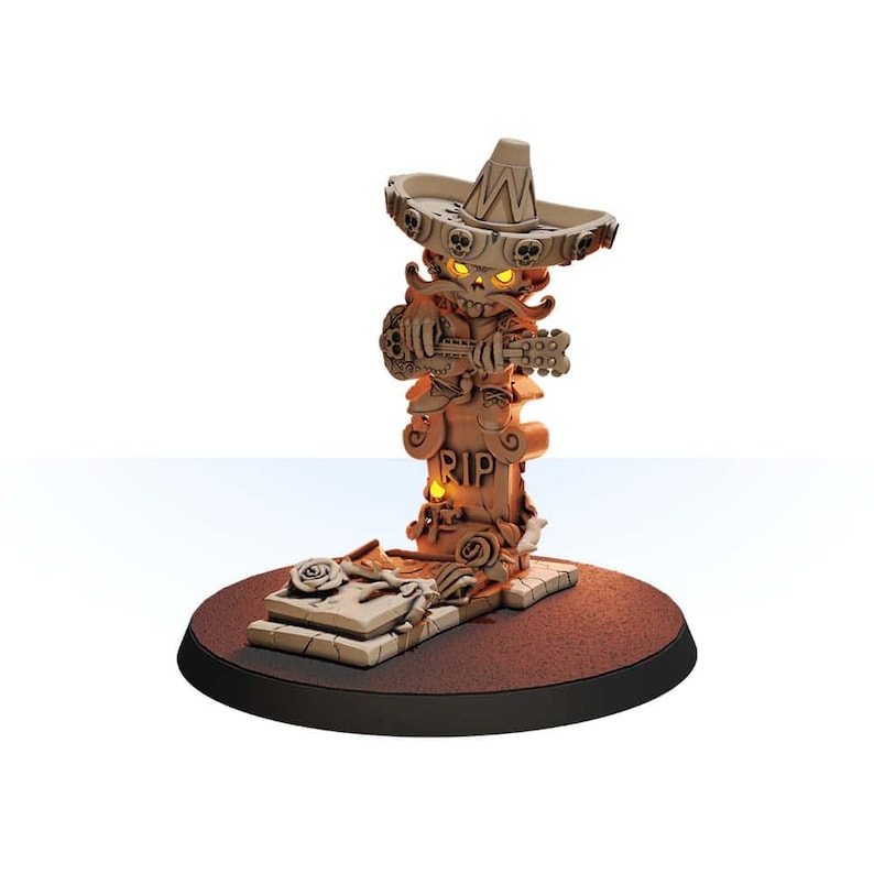 May include: A small, detailed, beige-colored figurine of a skeleton wearing a sombrero and playing a guitar. The skeleton is standing on a tombstone with the inscription "RIP". The figurine is on a brown base.
