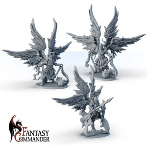 May include: Three grey miniature figures of winged warriors. Each figure has large, detailed wings, armour, and is holding a chain with a spiked ball. The figures are on small circular bases. The Fantasy Commander logo is in the lower left corner.